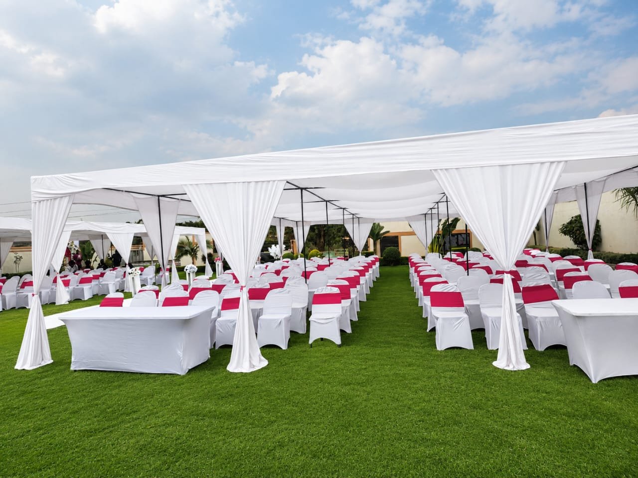 White event tents and coordinated guest chairs at Tamyka